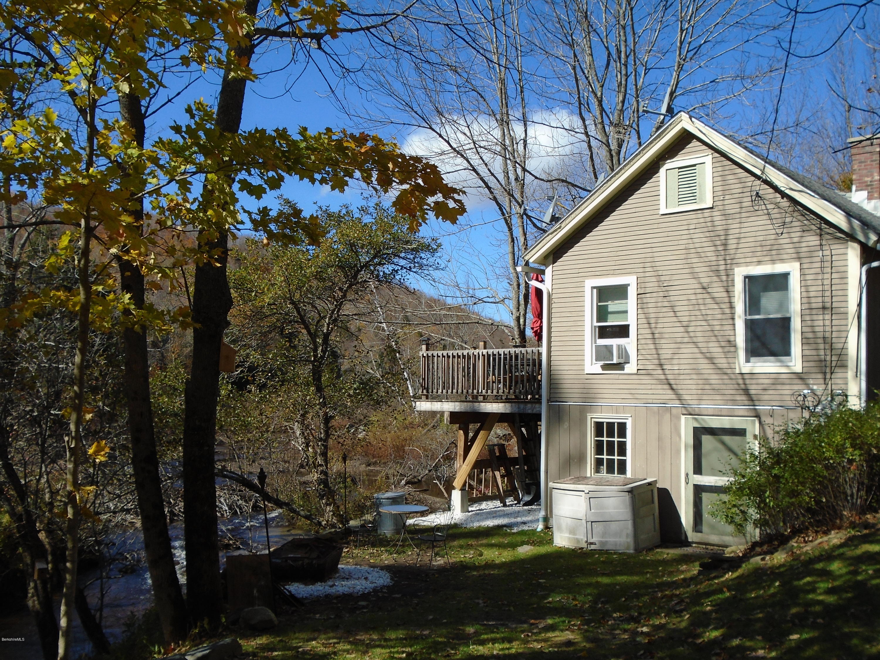 4 River Road Savoy, MA 01256 - Photo 3 of 39 a view of a house with backyard and sitting area
