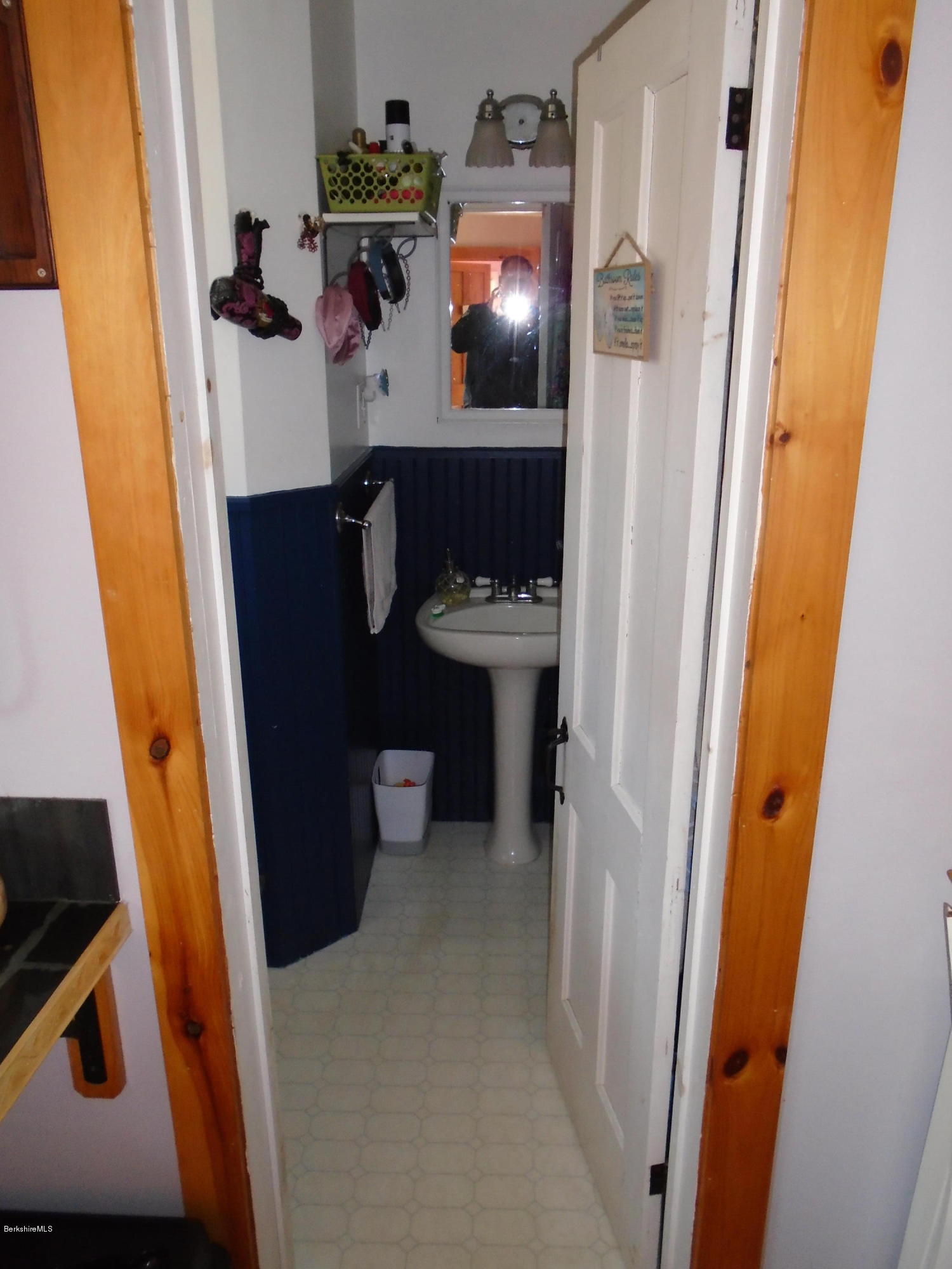 4 River Road Savoy, MA 01256 - Photo 22 of 39 a bathroom with a sink and mirror with toilet