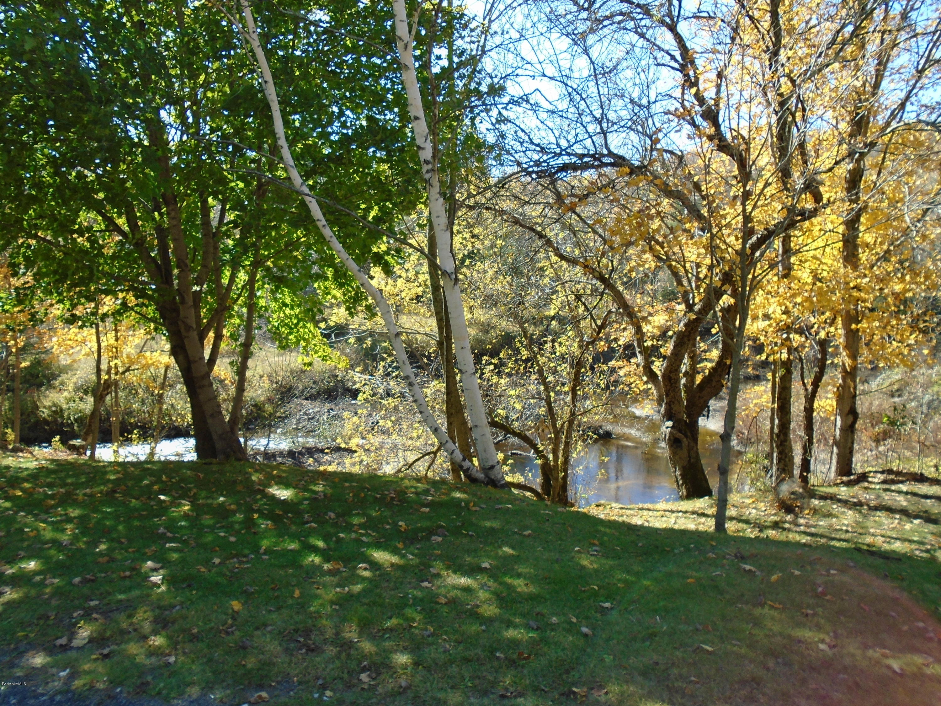4 River Road Savoy, MA 01256 - Photo 5 of 39 a backyard of a house with lots of green space