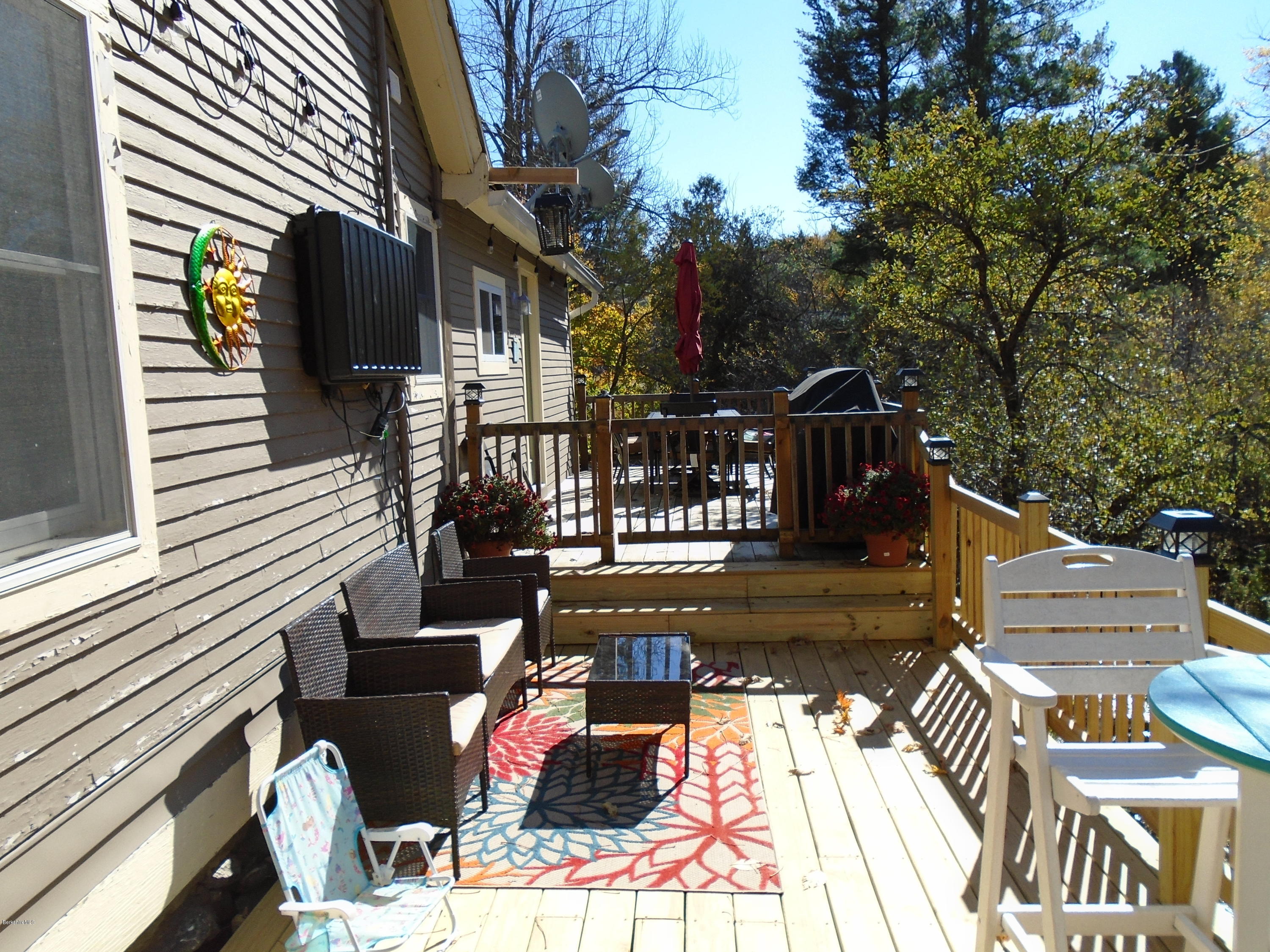 4 River Road Savoy, MA 01256 - Photo 10 of 39 a view of a house with backyard and sitting area