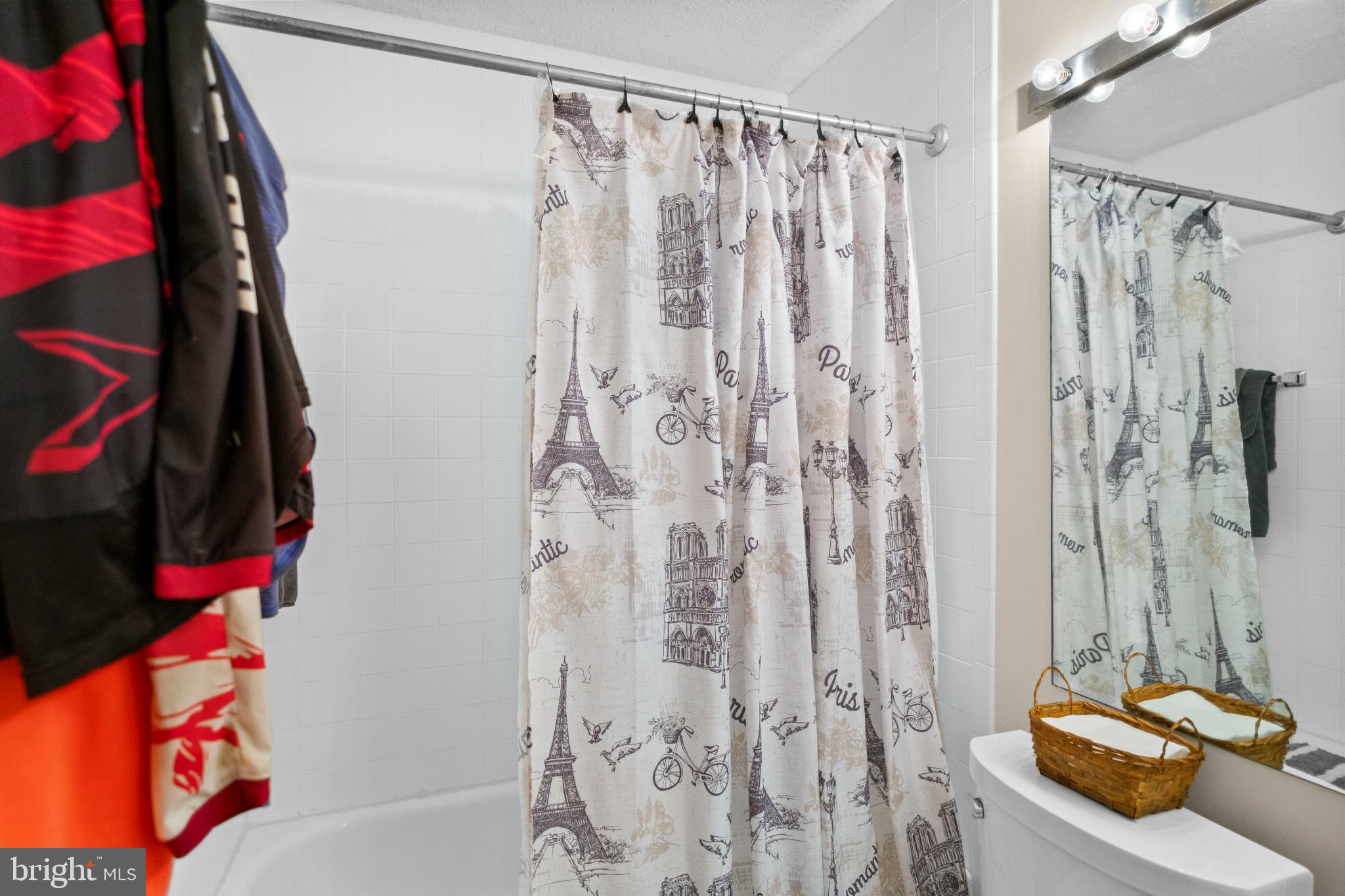 2363 Nutmeg Terrace Baltimore, MD 21209 - Photo 14 of 29 a bathroom with a shower curtain and a sink
