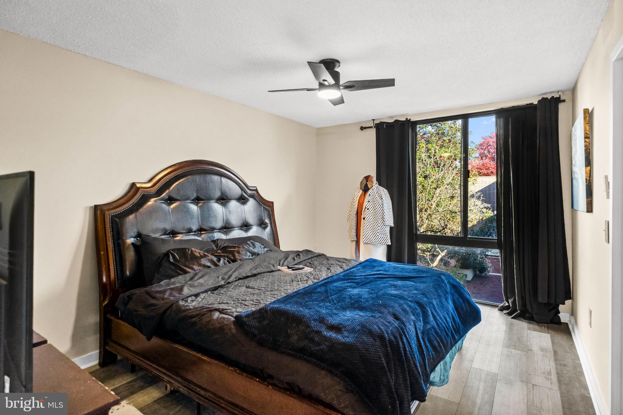 2363 Nutmeg Terrace Baltimore, MD 21209 - Photo 18 of 29 a bedroom with a bed and a large window