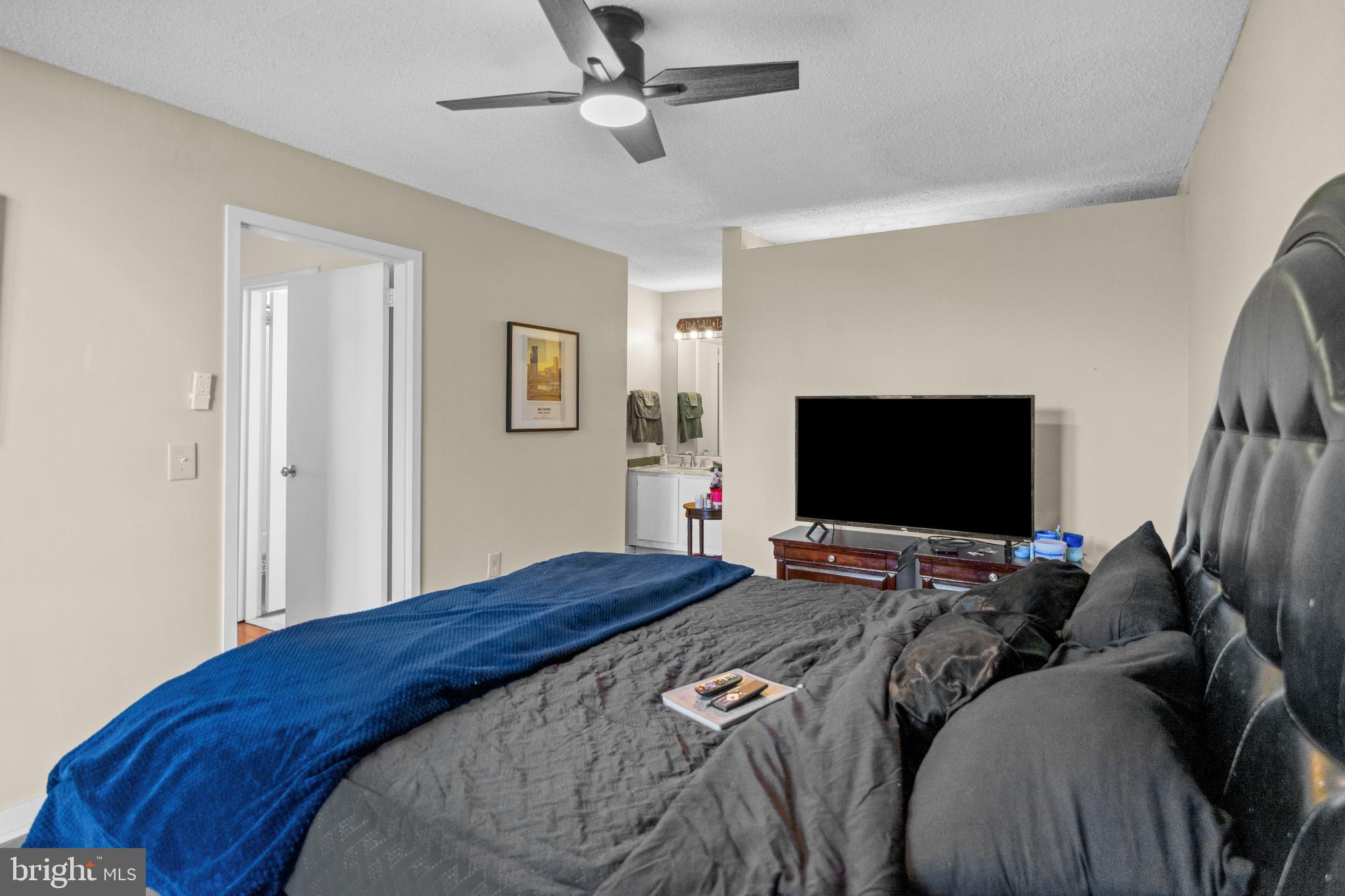 2363 Nutmeg Terrace Baltimore, MD 21209 - Photo 19 of 29 a bedroom with a bed and a flat screen tv