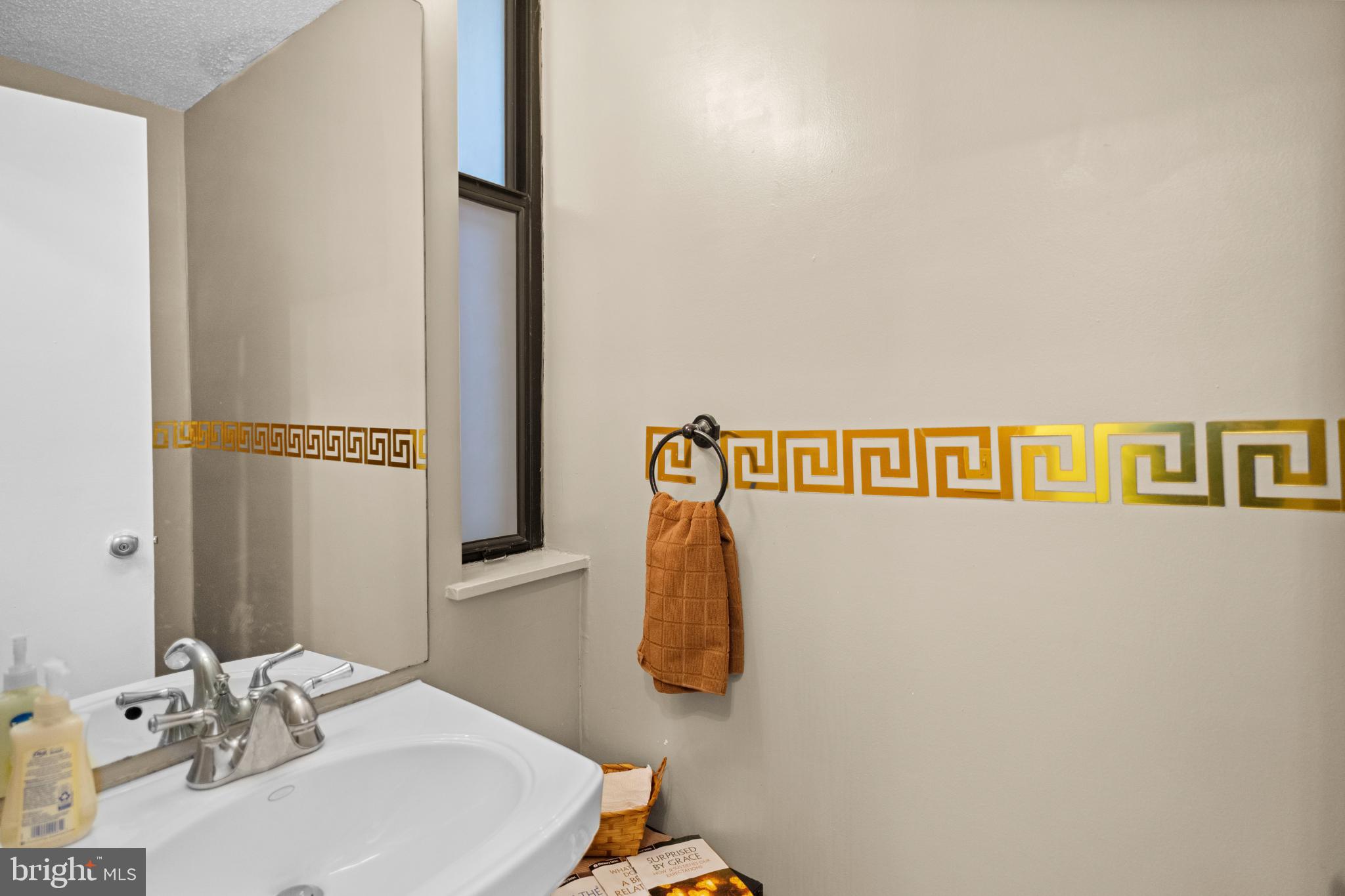 2363 Nutmeg Terrace Baltimore, MD 21209 - Photo 10 of 29 a bathroom with a sink and a mirror