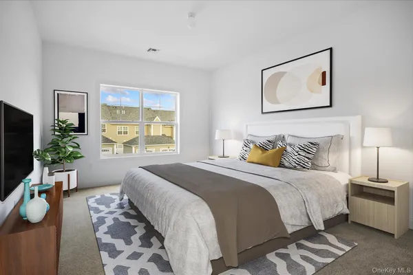 a bedroom with bed and a window