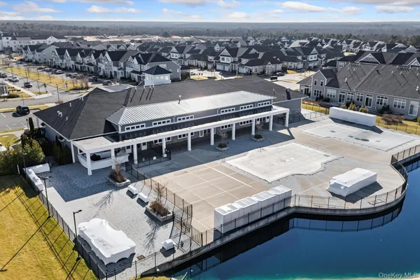 an aerial view of residential houses with swimming pool