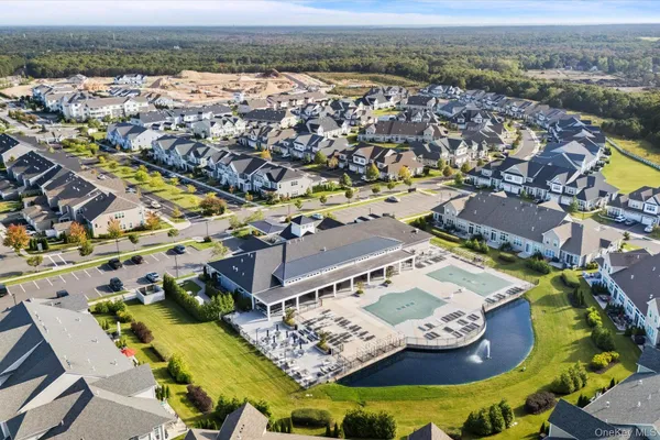 an aerial view of a house with a swimming pool