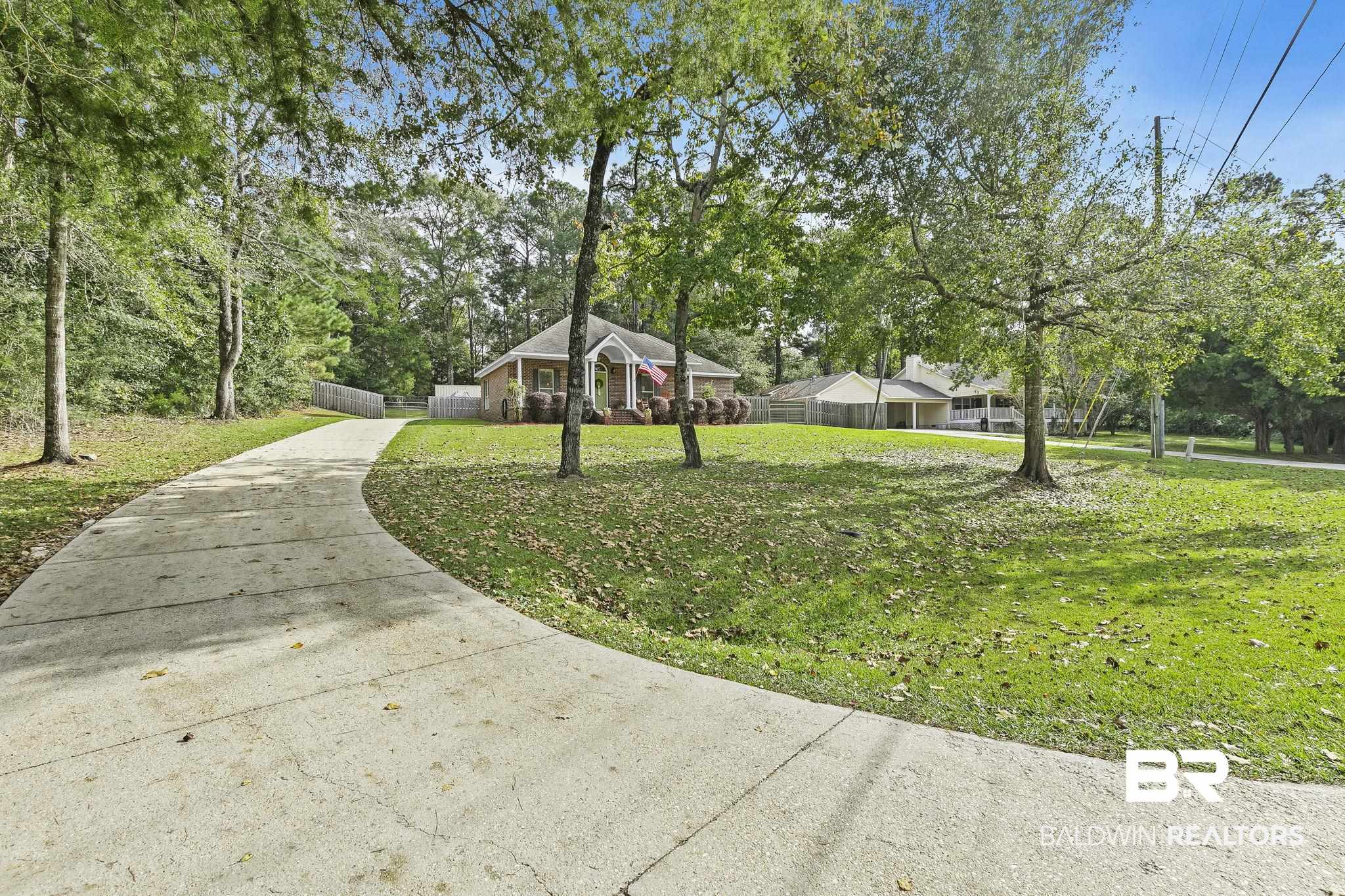 32072 Buzbee Road Daphne, AL 36527 - Photo 2 of 41 Exterior space featuring a yard