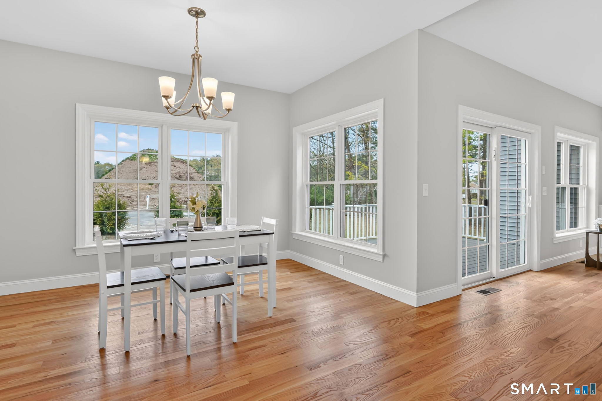 60 Liberty Lane Enfield, CT 06082 - Photo 18 of 38 a view of a dining room with furniture windows and wooden floor