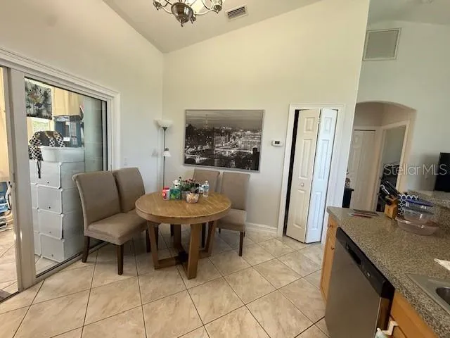 a living room with furniture and a mirror