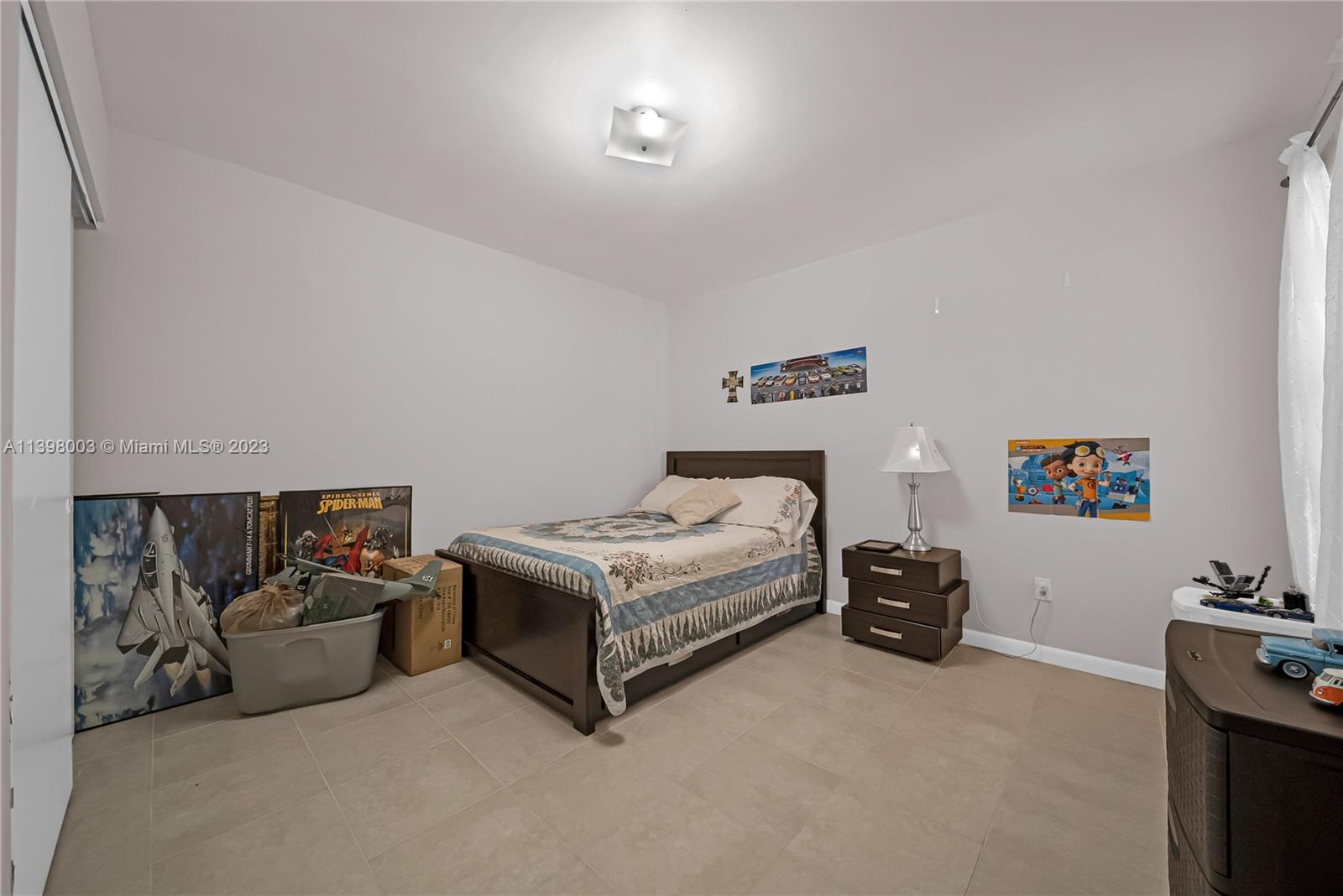 15330 Southwest 106th Terrace, Unit 903 Miami, FL 33196 - Photo 12 of 43 a bedroom with a bed and a couch