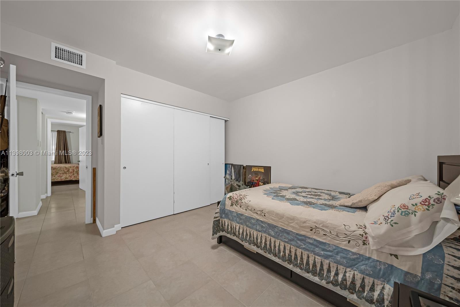15330 Southwest 106th Terrace, Unit 903 Miami, FL 33196 - Photo 13 of 43 a bedroom with a bed and a window