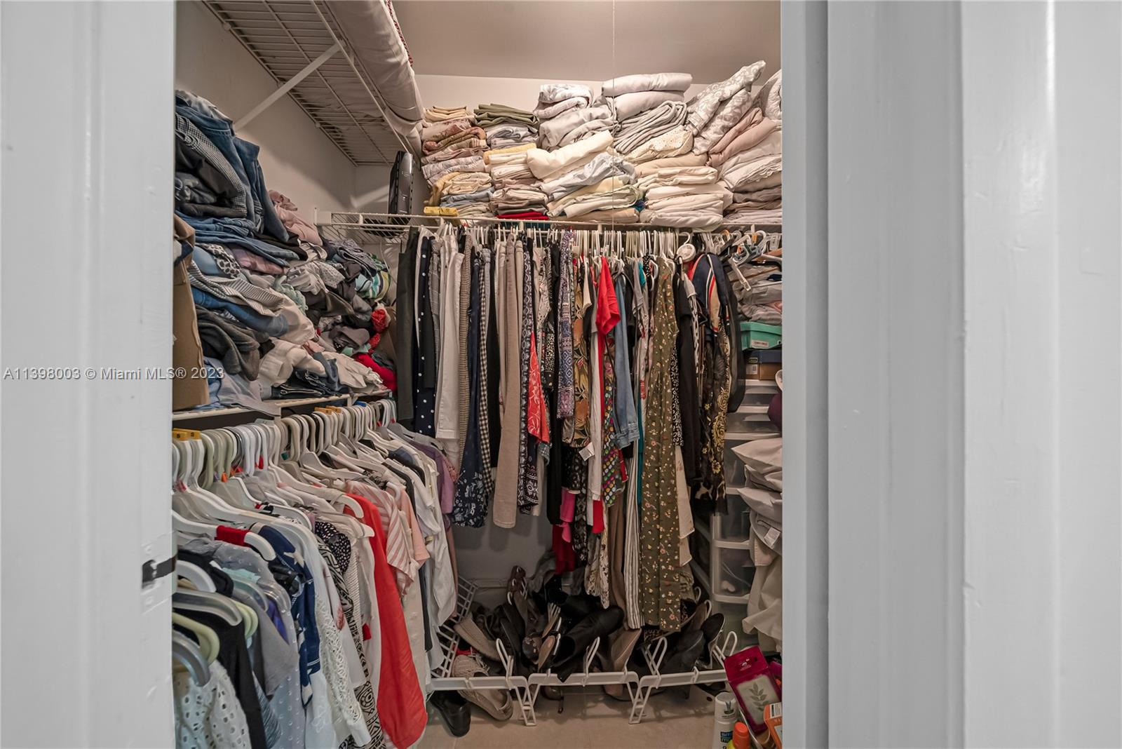 15330 Southwest 106th Terrace, Unit 903 Miami, FL 33196 - Photo 20 of 43 a view of walk in closet with clothes
