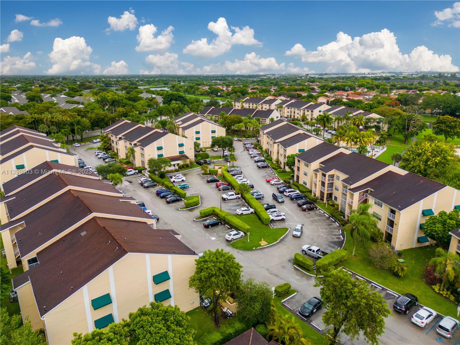 15330 Southwest 106th Terrace, Unit 903 Miami, FL 33196 - Photo 32 of 43 an aerial view of residential houses with outdoor space and street view
