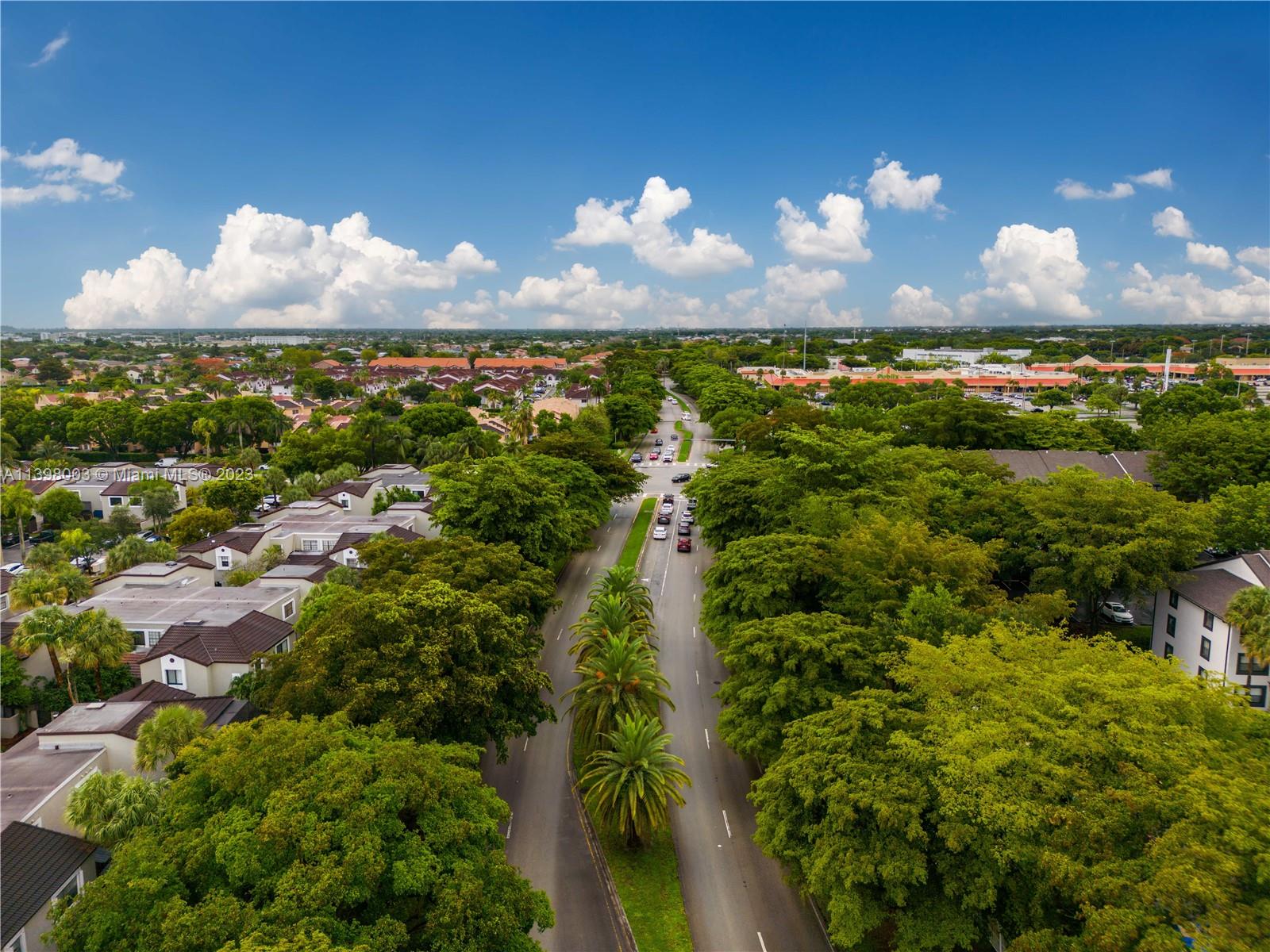 15330 Southwest 106th Terrace, Unit 903 Miami, FL 33196 - Photo 35 of 43 a view of a lake in middle of forest