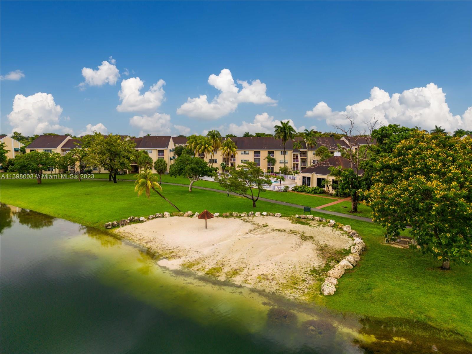 15330 Southwest 106th Terrace, Unit 903 Miami, FL 33196 - Photo 37 of 43 a backyard of a house with lots of green space