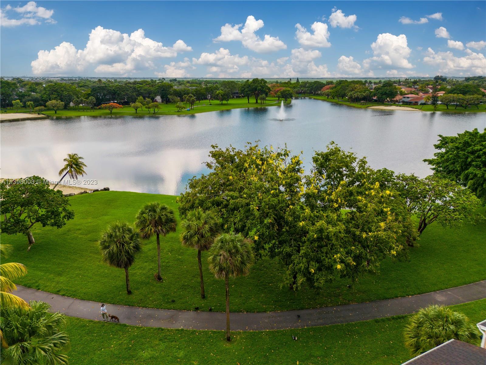 15330 Southwest 106th Terrace, Unit 903 Miami, FL 33196 - Photo 38 of 43 a view of a lake in a garden