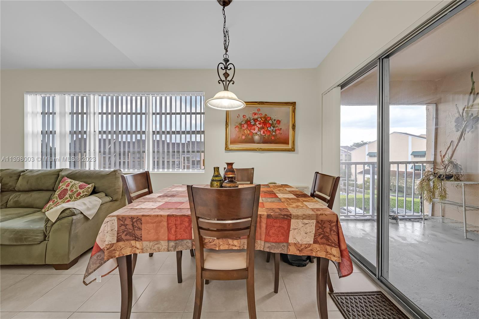15330 Southwest 106th Terrace, Unit 903 Miami, FL 33196 - Photo 10 of 43 a view of a livingroom with furniture and a window