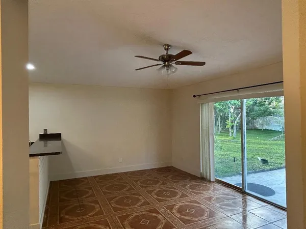 a view of an empty room and a window