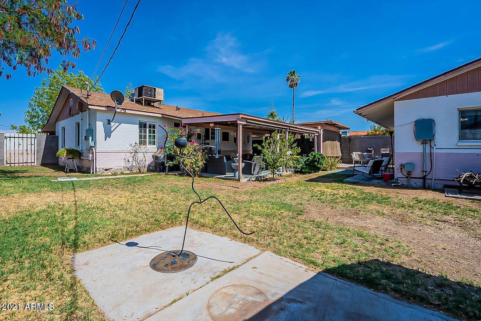 9416 North 3rd Avenue Phoenix, AZ 85021 - Photo 17 of 25 a view of a house with a yard porch and sitting area