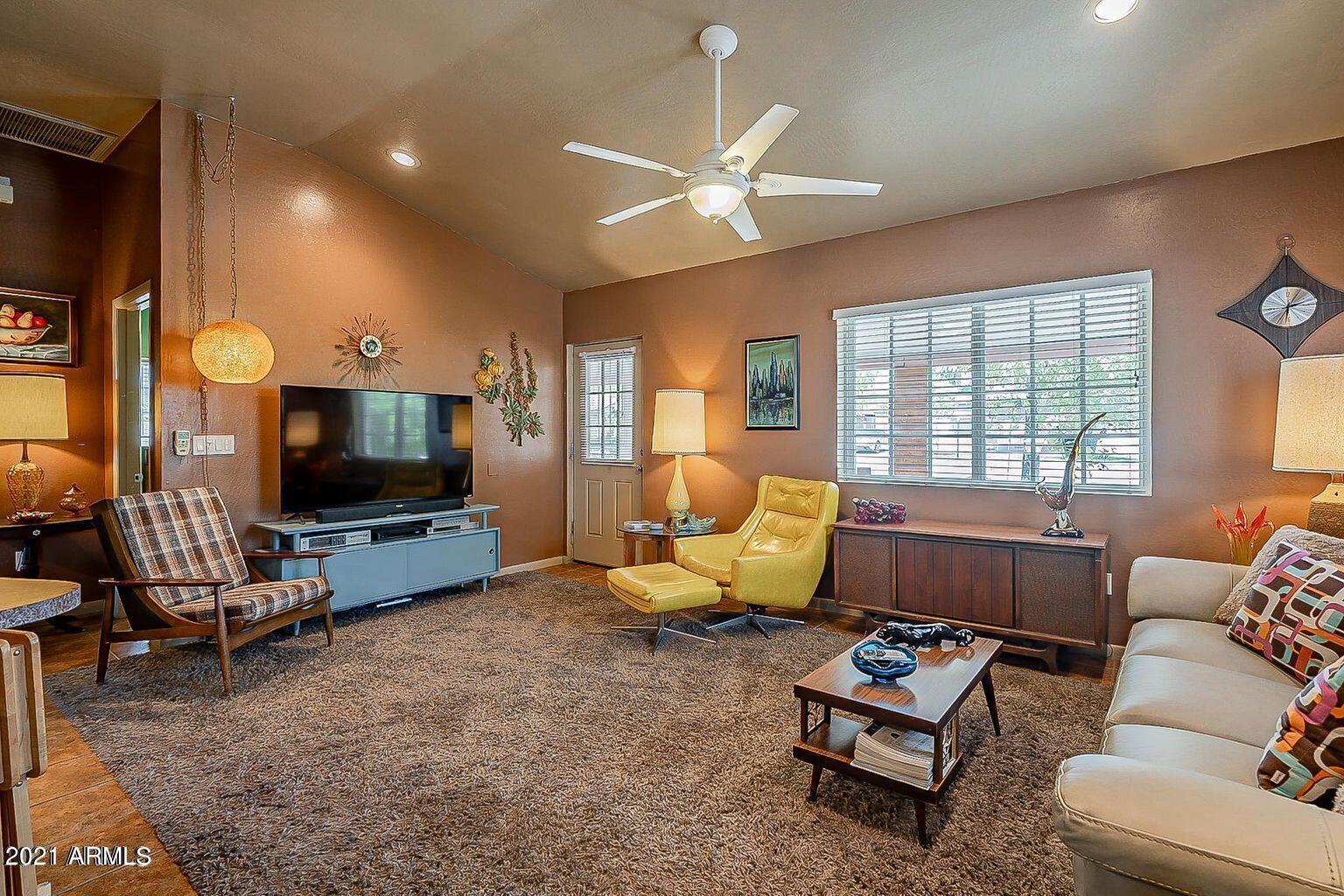 9416 North 3rd Avenue Phoenix, AZ 85021 - Photo 3 of 25 a living room with furniture and a flat screen tv