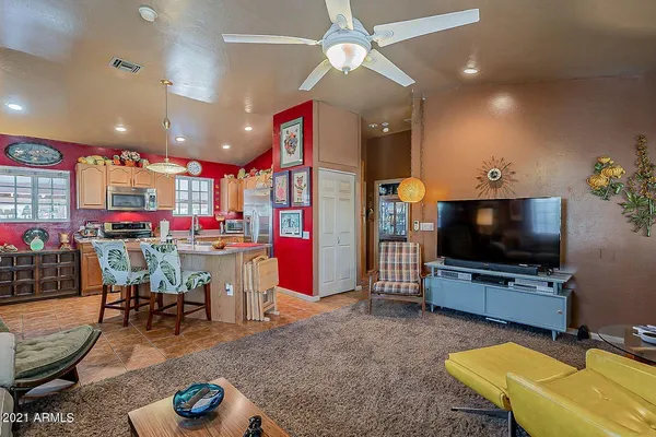 a living room with furniture and a flat screen tv