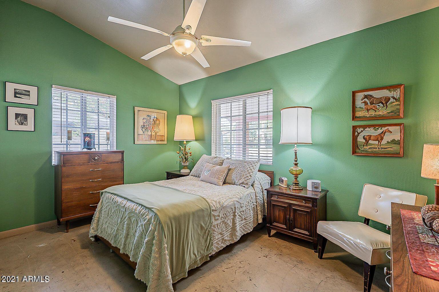 9416 North 3rd Avenue Phoenix, AZ 85021 - Photo 9 of 25 a bedroom with a bed table chair and a window
