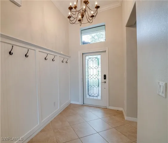 a view of an entryway with a chandelier