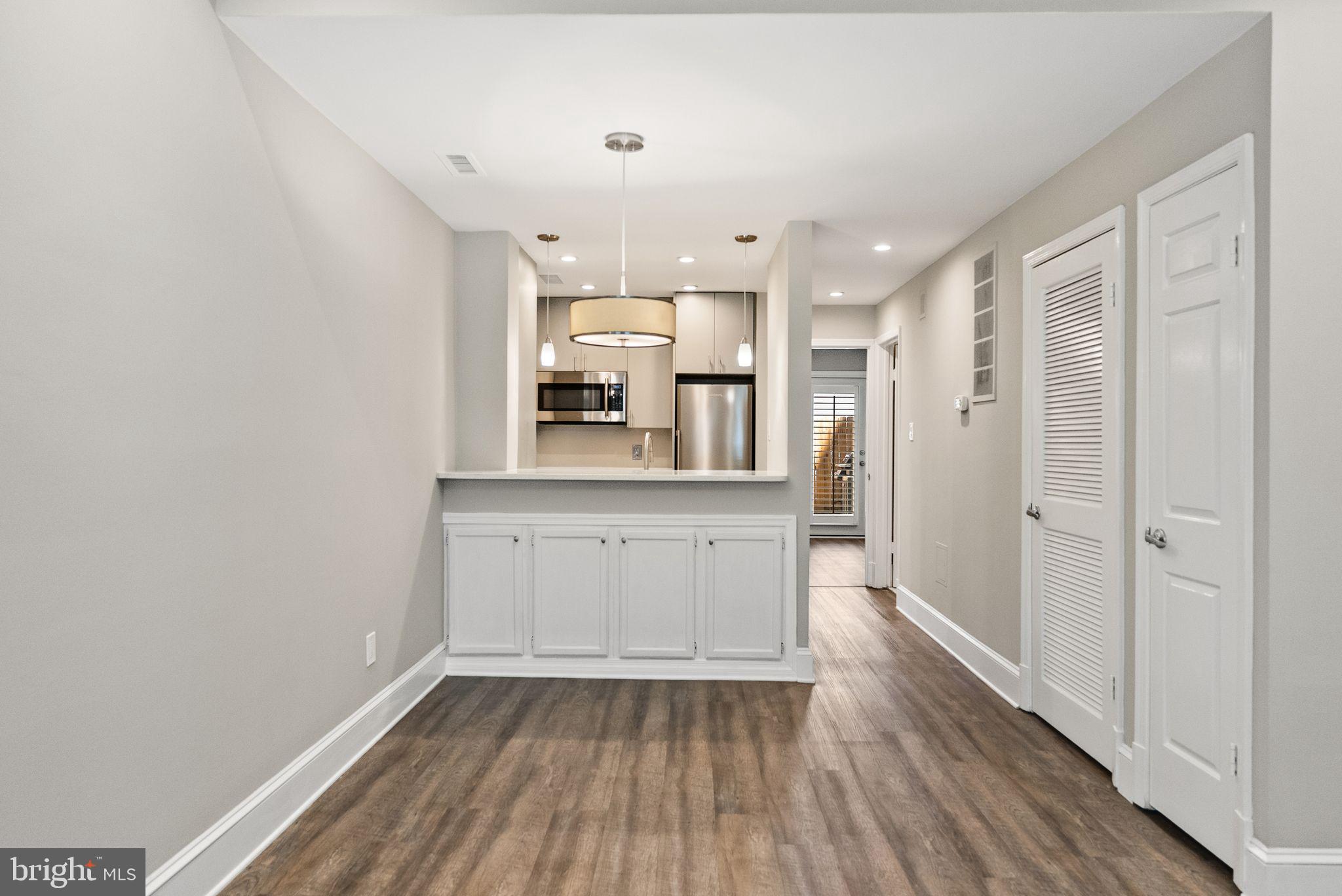 2011 Hillyer Place Northwest Washington, DC 20009 - Photo 15 of 21 a view of a kitchen with wooden floor and electronic appliances