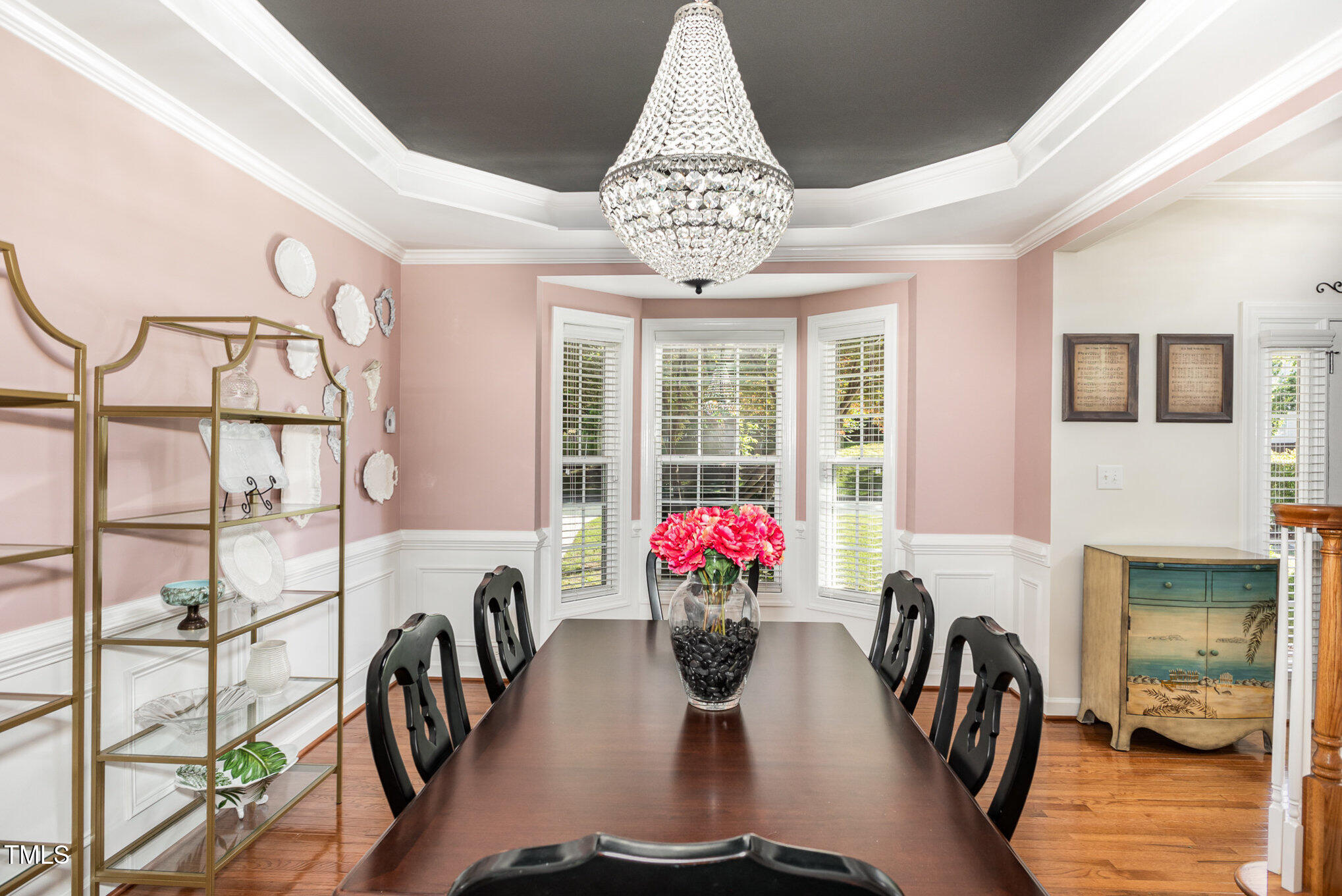 1603 Timber Wolf Drive Durham, NC 27713 - Photo 9 of 41 a view of a dining room with furniture a chandelier and wooden floor