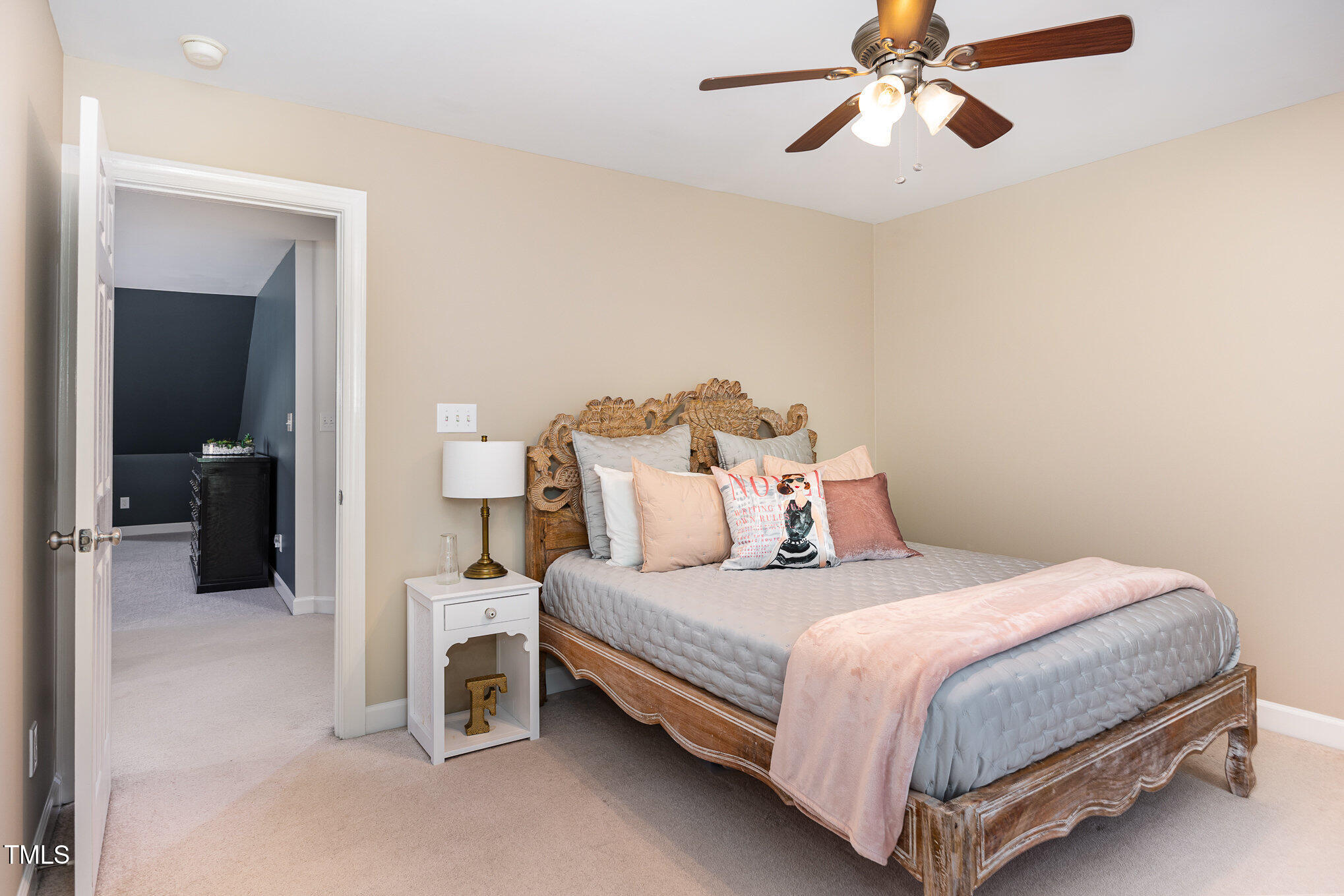 1603 Timber Wolf Drive Durham, NC 27713 - Photo 25 of 41 a bedroom with a bed and a chandelier