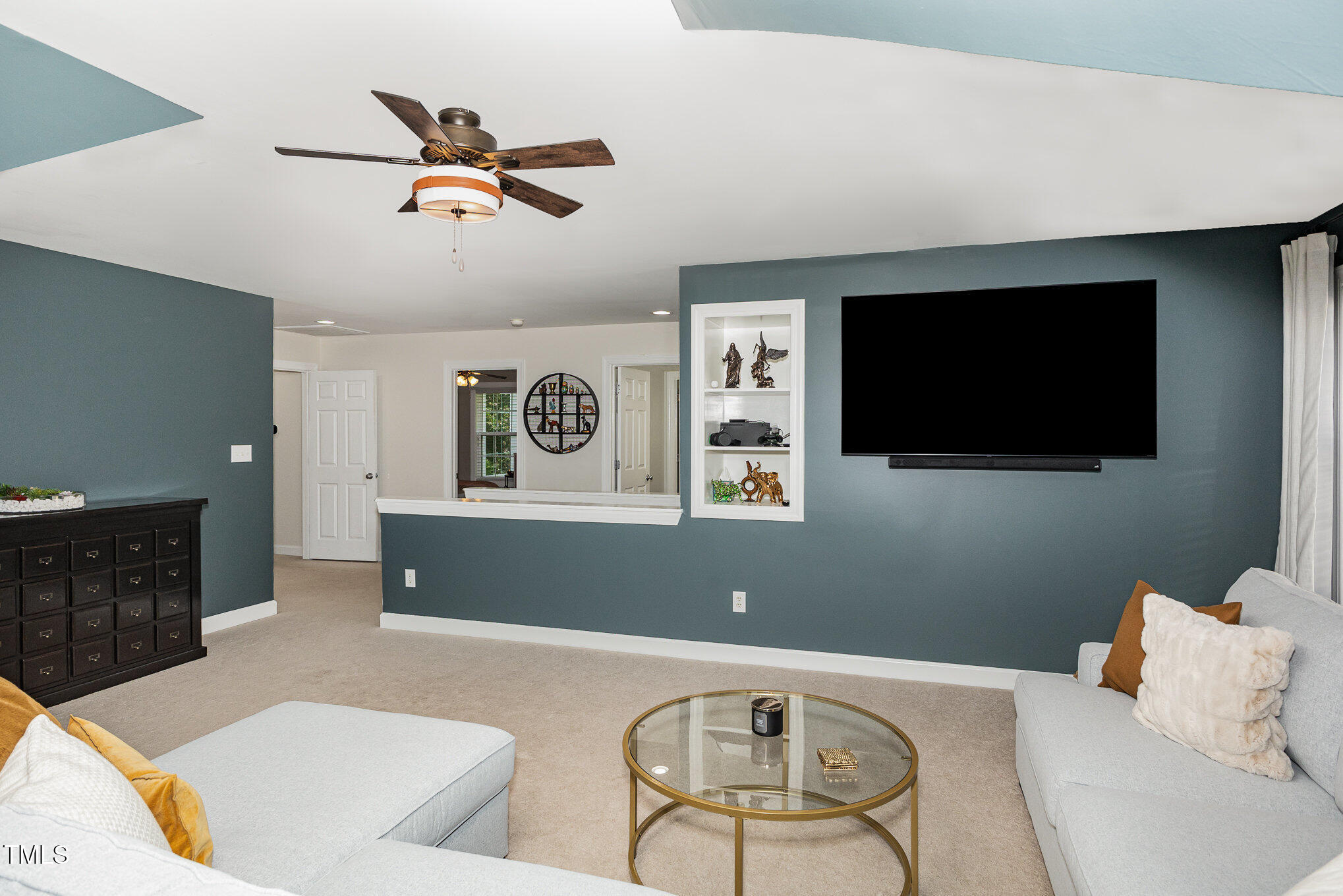 1603 Timber Wolf Drive Durham, NC 27713 - Photo 31 of 41 a living room with furniture and a flat screen tv