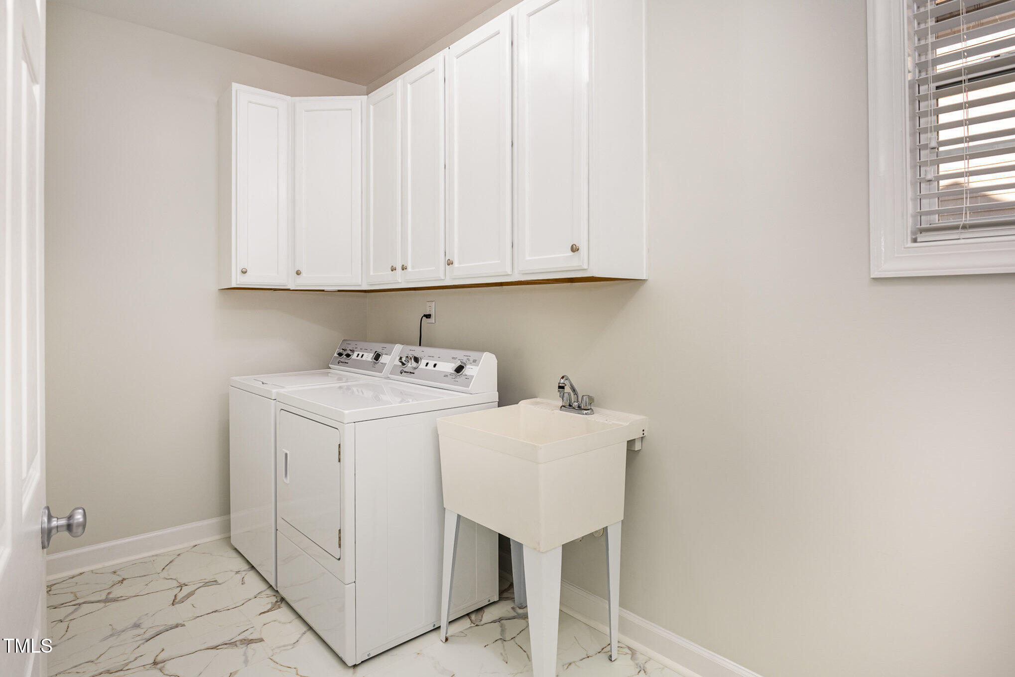 1603 Timber Wolf Drive Durham, NC 27713 - Photo 33 of 41 a utility room with dryer and washer