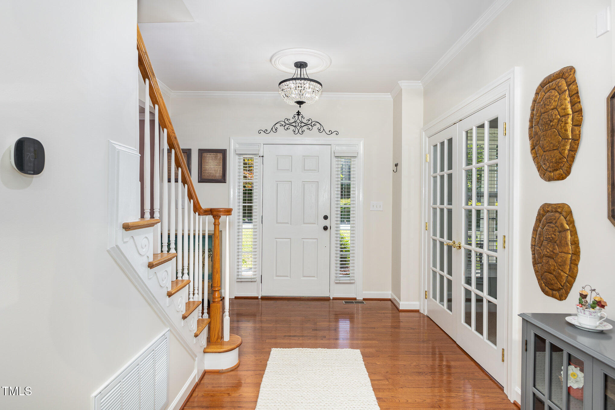1603 Timber Wolf Drive Durham, NC 27713 - Photo 4 of 41 a view of an entryway with wooden floor