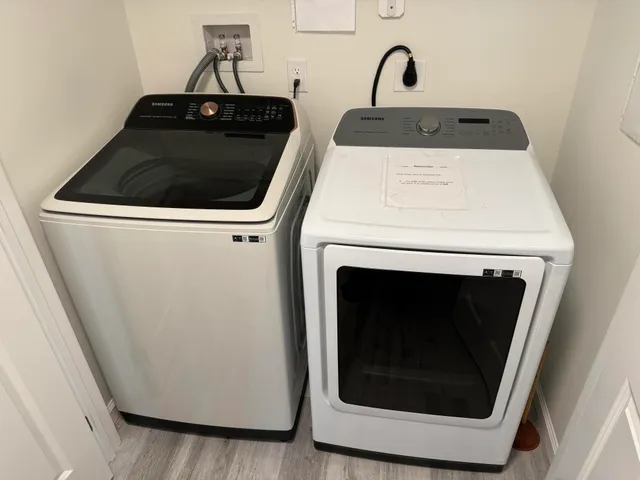 a close view of a utility room with washer and dryer