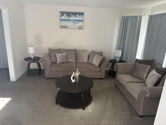 a living room with furniture and a couch