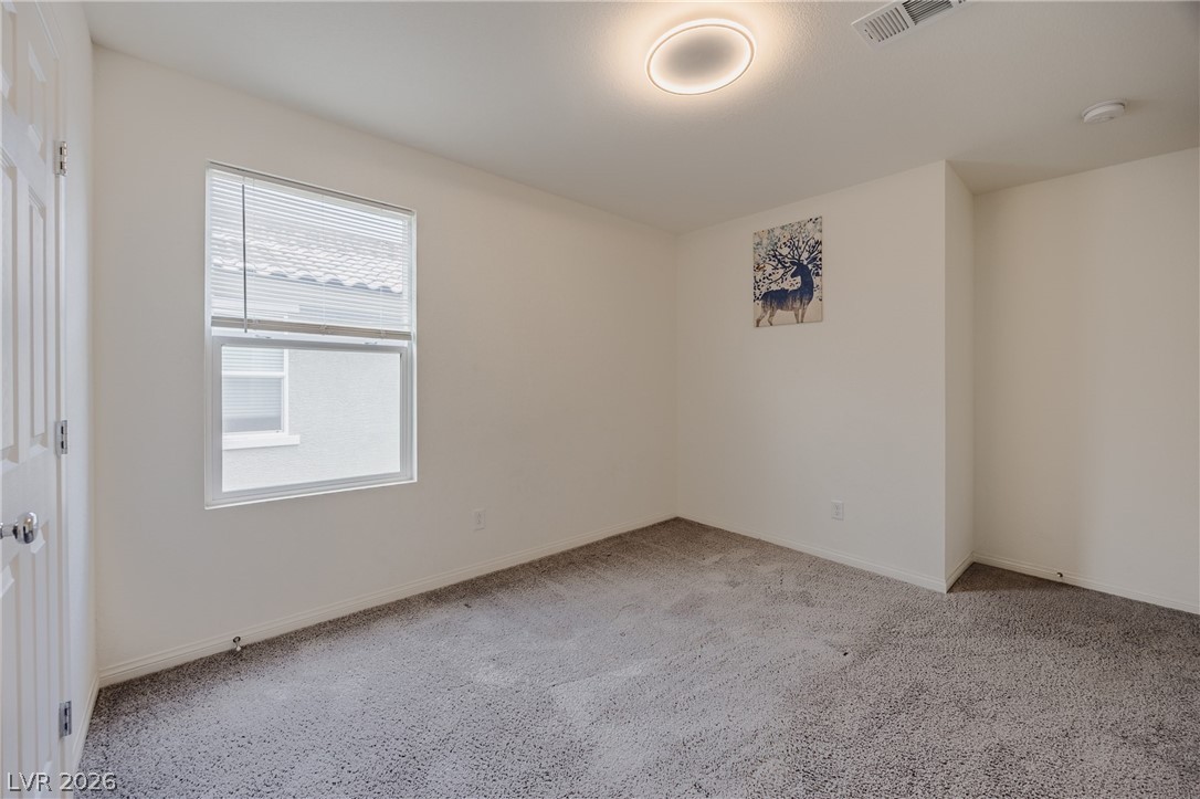 5927 Coja Street Las Vegas, NV 89113 - Photo 22 of 32 Unfurnished room with carpet floors and baseboards