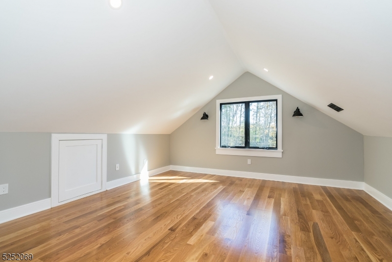 76 Burnet Road, Unit 2 Florham Park, NJ 07940 - Photo 17 of 24 a view of an empty room with wooden floor and a window