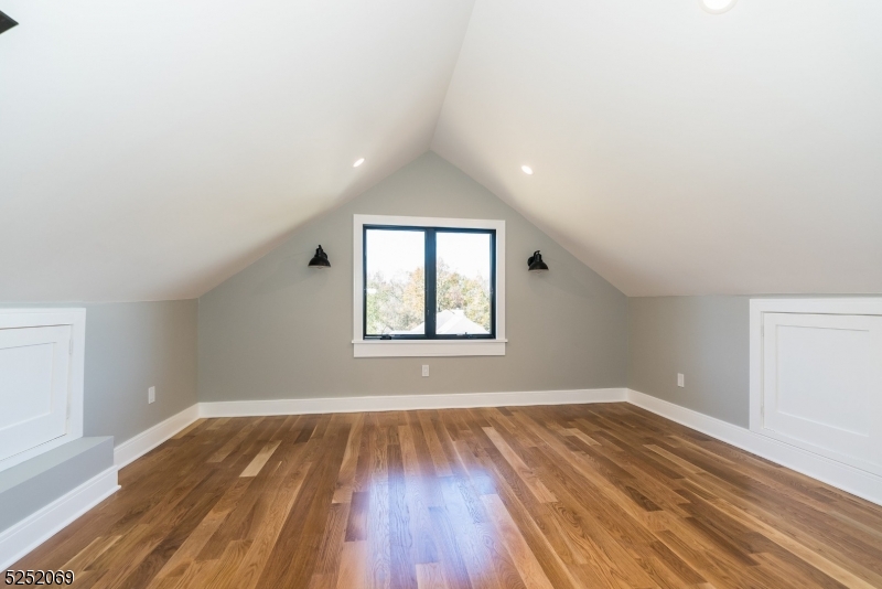 76 Burnet Road, Unit 2 Florham Park, NJ 07940 - Photo 18 of 24 an empty room with wooden floor and windows
