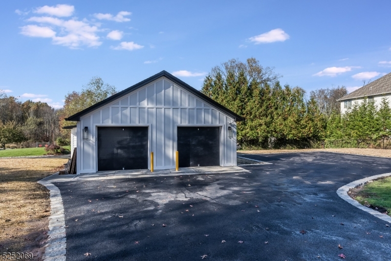 76 Burnet Road, Unit 2 Florham Park, NJ 07940 - Photo 20 of 24 a front view of a house with a yard and garage