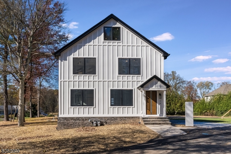 76 Burnet Road, Unit 2 Florham Park, NJ 07940 - Photo 2 of 24 a view of a house with a yard