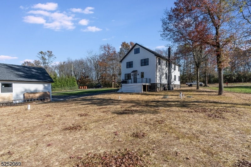76 Burnet Road, Unit 2 Florham Park, NJ 07940 - Photo 23 of 24 a front view of a house with a yard
