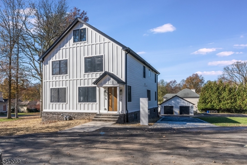 76 Burnet Road, Unit 2 Florham Park, NJ 07940 - Photo 3 of 24 a front view of a house with a yard