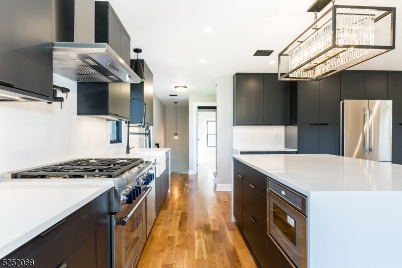 76 Burnet Road, Unit 2 Florham Park, NJ 07940 - Photo 6 of 24 a kitchen that has a sink a stove and a refrigerator