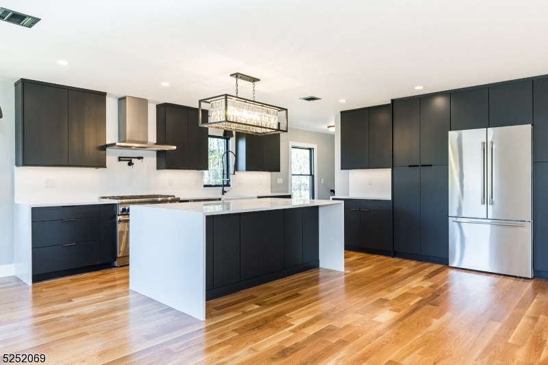 76 Burnet Road, Unit 2 Florham Park, NJ 07940 - Photo 8 of 24 a kitchen with a refrigerator and a sink