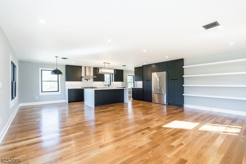 76 Burnet Road, Unit 2 Florham Park, NJ 07940 - Photo 9 of 24 a view of kitchen with kitchen island microwave and stove