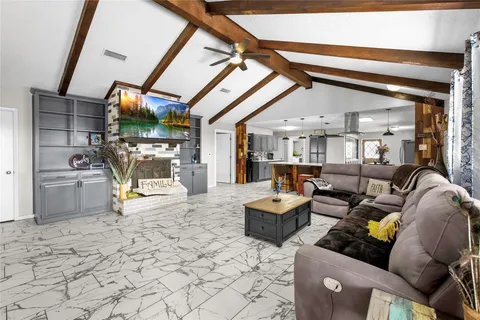 a bedroom with a bed dresser and a flat screen tv