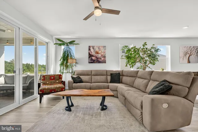 a bathroom with a double vanity sink mirror and toilet