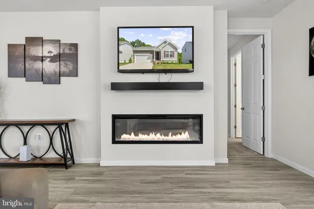 a view of dining room with furniture and wooden floor