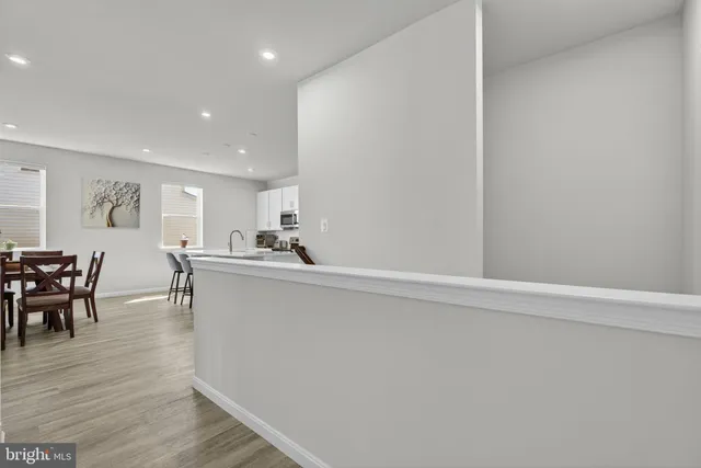 a view of an entryway with wooden floor
